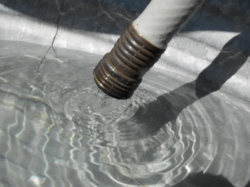 Filling up the washtub with a hose