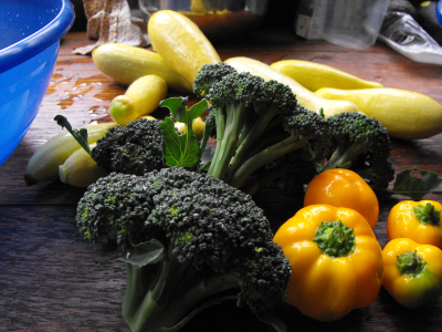 Orange peppers, summer squash, and broccoli