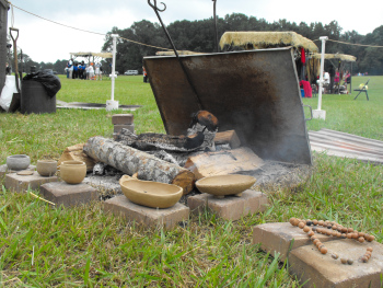 Pit-firing pottery.