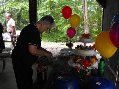 Sheila decorates the cake