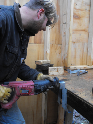 Cutting a bracket in half with the saw-saw