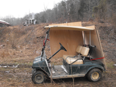 Hauling plywood on the golf cart
