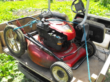 mower on golf cart bed