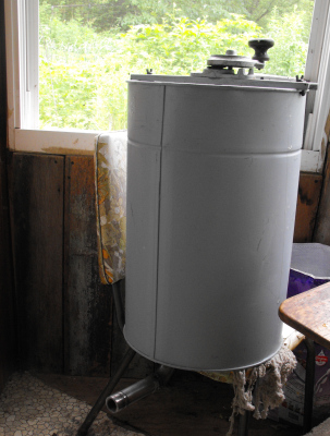 Side view of a honey extractor