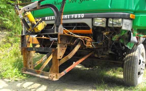 Mitsubishi Fuso 4 wheel drive dump truck close up of front