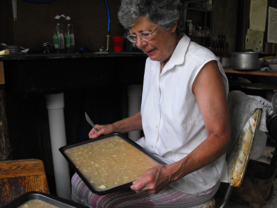 Shaking a pan of peach puree