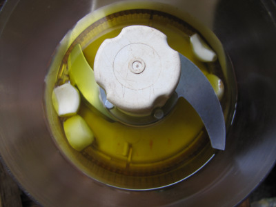 Garlic and olive oil in a food processor