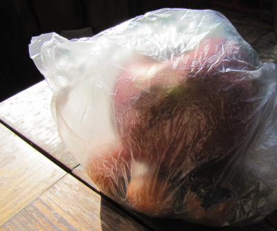 Ripen persimmons by putting them in a bag with an apple