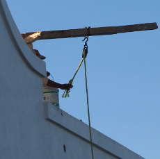 Hoisting a bucket up to the roof