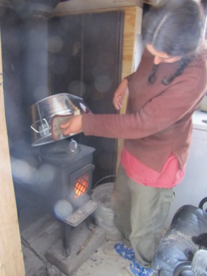 Testing the temperature on top of the wood stove