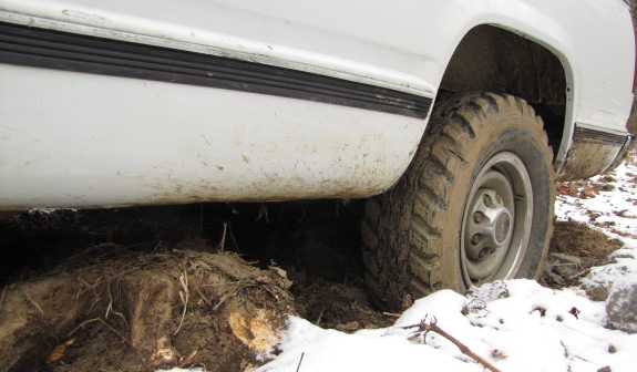 truck is stuck due to stump in the way