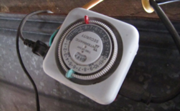 chicken water heater timer closeup