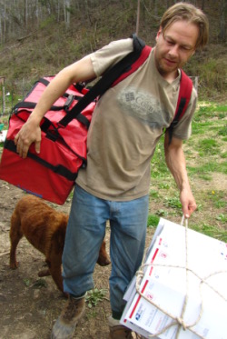 oversized bag image of man carrying said container