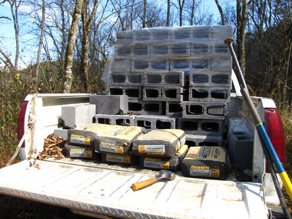 cube of 6 inch cinder blocks in the back of a truck