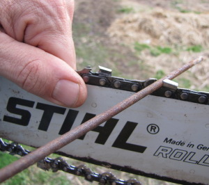 close up of file sharpening chain of Stihl chainsaw