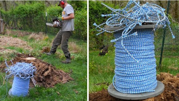 big spool of nylon rope sitting on top of a large stump in a garden