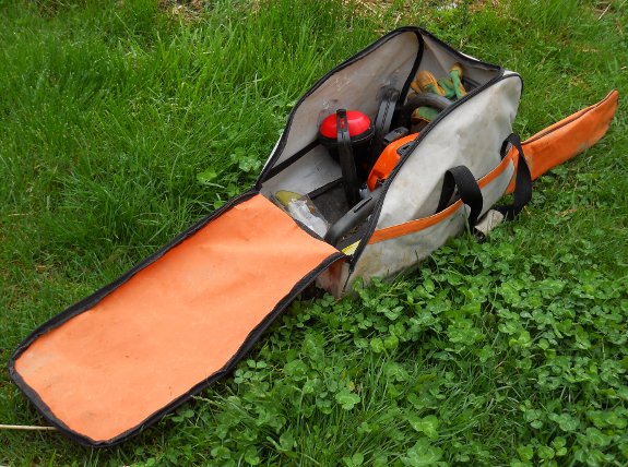 Chainsaw carrying bag with chainsaw and safety gear which is not an official Stihl product
