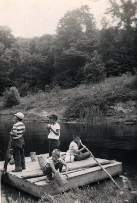 Boys playing in a pond