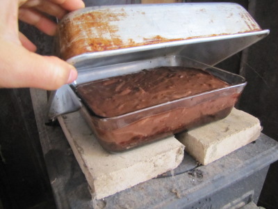 Cooking a cheesecake on a wood stove