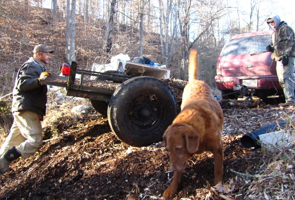 winching the utility trailer up the hill with Lucy