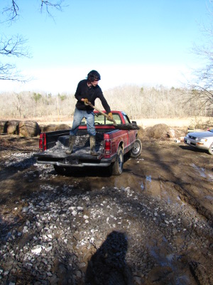 Spreading gravel on a driveway