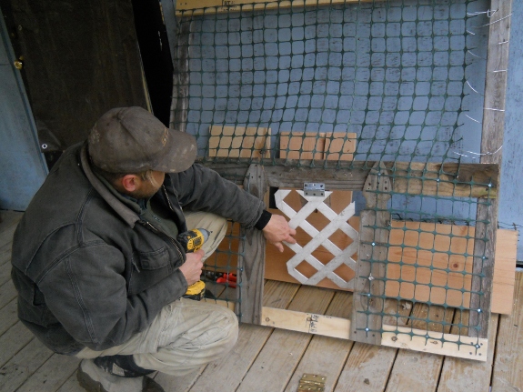 image of home made gate with dog door