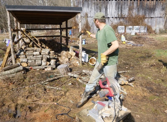 using miter saw to cut firewood