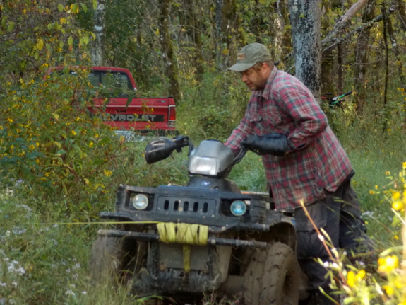 ATV with truck in the background