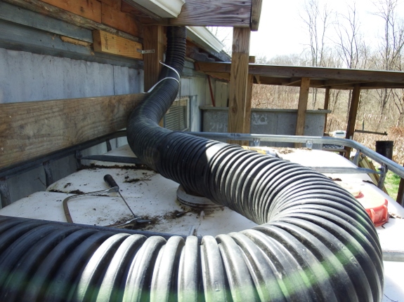 top part of IBC tank where two different gutter pipes converge