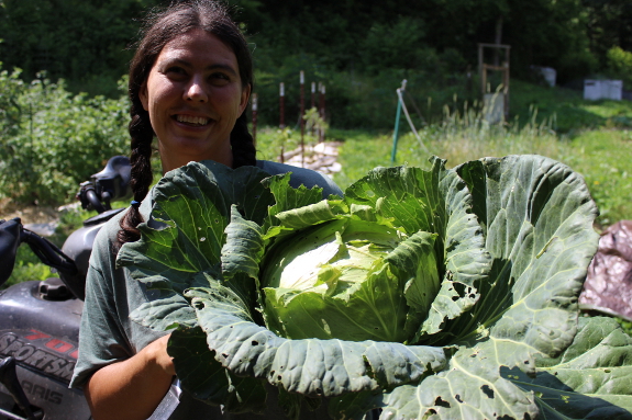 Anna holding big cabbage head