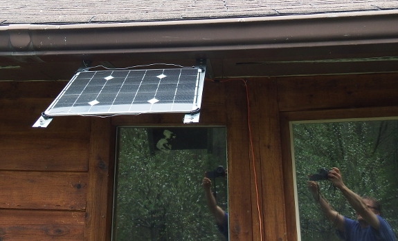 Small solar panel window mounting.