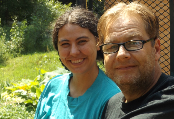 Mark and Anna sitting in a Kubota x900.