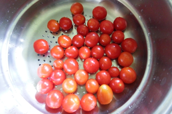 Bowl of volunteer tomatoes.