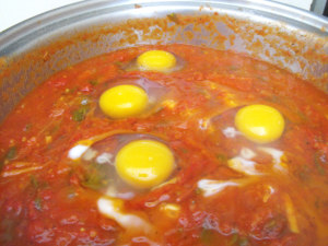 Eggs poached in spaghetti sauce